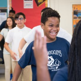 Students at US Wiggins College Preparatory Lab Family School rehearse their step routine with teaching artist Maxine Lyle.