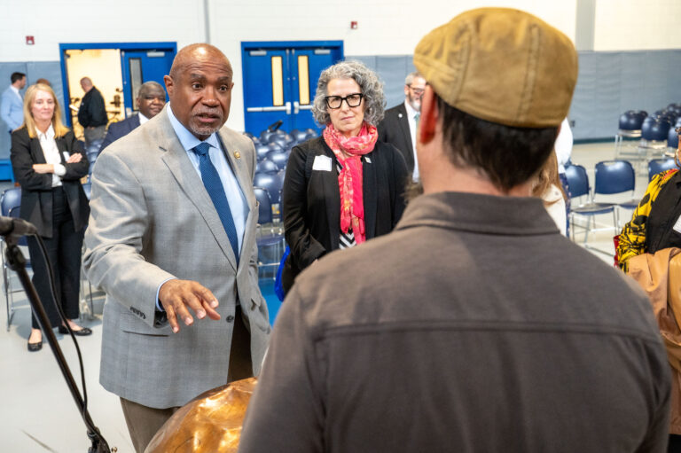 Congressman Conaway and Michele Russo, President and CEO talking with Eric Waldman from The Junk Jam Band.